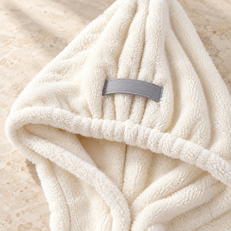 Gray securing loop on the cream Eira hair drying wrap
